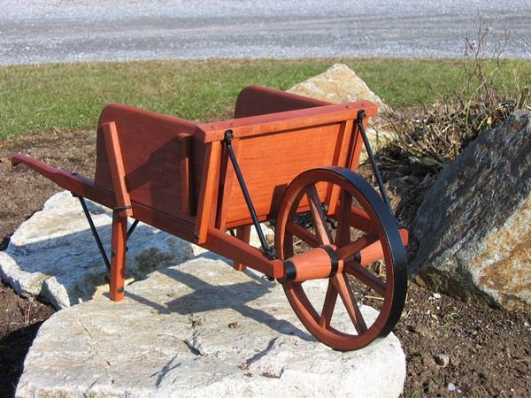 SMALL RUSTIC WHEELBARROW, WELL BUILT.  